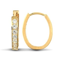 9ct yellow gold cubic zirconia set oval huggie earrings.